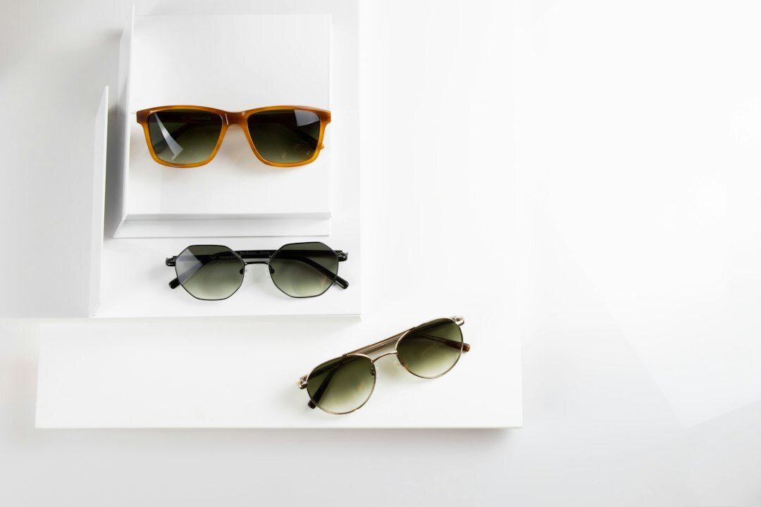 Designer sunglasses displayed on a polished marble surface
