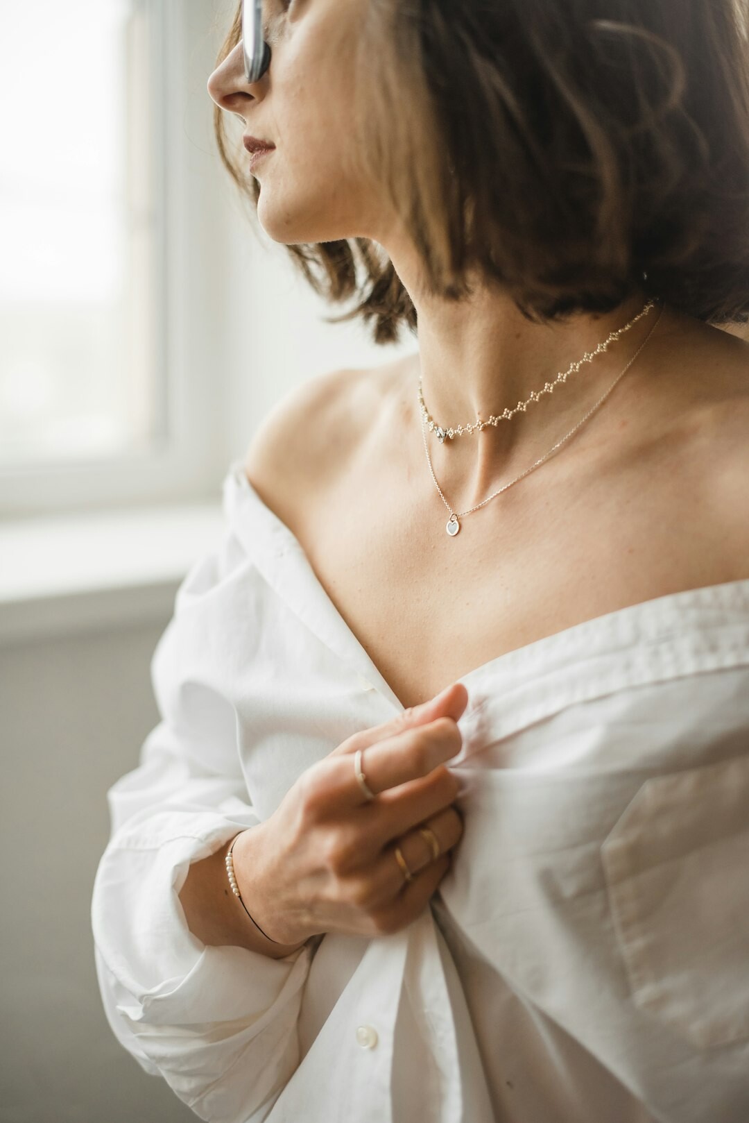 elegant woman trying on jewelry