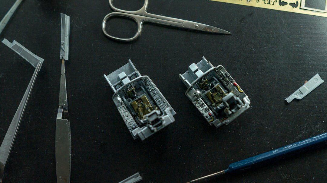 Watchmaker's hands assembling a mechanical movement with precision tools
